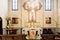 Valencia, Spain - March 30, 2019: Interior of a chapel of a Catholic church with a portrait of Jesus and crucifix on the altar