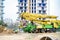 Valencia, Spain - March 5, 2021: A concrete pumper operated by a worker on a construction site