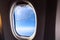 Valencia, Spain - March 8, 2019: Flaps of an Ryanair airplane seen from inside during a flight over the clouds of the sky