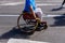 Valencia, Spain - May 19, 2019: Disabled athlete runner competing in a race in his wheelchair