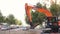 Valencia, Spain - May 19, 2019 : A large excavator digs out of a ditch in a sanitation works in the city.