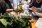 Valencia, Spain - November 9, 2018: Women during a vegan cooking course preparing ingredients for cooking