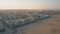 VALENCIA, SPAIN - SEPTEMBER 22, 2018. Aerial view of promenade and beachfront hotels and restaurants at sunset