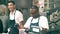 VALENCIA, SPAIN - SEPTEMBER 22, 2018. Cheerful vendors at work in Spanish meat specialties stall in Mercado Central or