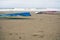 Valencia, Spain - September 30, 2018: Windsurf boards in the sand of a Spanish beach while surfers wait for the right wave