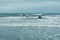 Valencia, Spain - September 30, 2018: Windsurfers trying to ride small waves during a storm