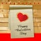 Valentine card with hearts and wooden boards background - vector