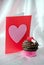 Valentine with chocolate frosted cupcake