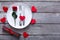 Valentine day background, cutlery with rose on plate on wood