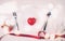 Valentine day concept, wineglass and red ribbon and utensil put in heart on white wooden table background with bokeh, champaign