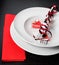 Valentine day dinner with table setting in red and elegant heart ornaments