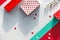 Valentine day flat lay, top view in red, white and green mint colors. Geometric two tone split paper background with gift boxes,