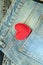 Valentine day, heart on jeans pocket background, top view