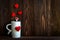 Valentine Day with red cup coffee Sewed pillow hearts row border, old wood background,