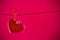 Valentine day series, decorative red heart hanging on red background