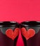 Valentine day series, detail of cups of milk with decorative heart on red background