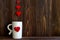 Valentine Day with white cup coffee Sewed pillow hearts row border, old wood background,