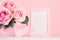 Valentine days background - elegant pastel pink roses bouquet, decorative heart with ribbon, blank frame for advertising on white.