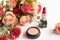 Valentine Gift. Makeup cosmetics tools background and beauty cosmetics, products and facial cosmetics package lipstick with flower
