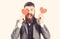 Valentine greeting. Happy bearded man with red hearts greeting Valentine
