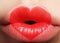 Valentine Heart on beautiful female Lips. Sweet Kiss. Love Makeup for Valntines Day. Cute Shape Heart like Symbol of Love. Celebra