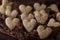 Valentine heart-shaped cookies in white chocolate and coconut on a dark background. Selective focus. Valentine`s Day in the form o