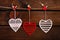 Valentine hearts hanging on wooden background