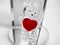 Valentine I love you red heart and teddy bear figurine standing on glass mirror