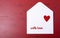 Valentine letter envelope on red background.