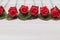 Valentine love heart orderly row of rose on wood