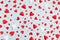 Valentine or Mother day festive pattern from many various red hearts on pastel blue background top view and flat lay