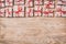 Valentine or other holidays concept. Lots of Gift boxes on wood background top view. Presents in craft paper decorated with red