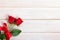 Valentine roses on white wood, copy space