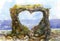 Valentine`s card in the form of a heart from a stone rock on the seashore. Watercolor painting.