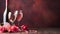 Valentine's Day background with champagne glasses, red roses and hearts. Romantic celebration of Valentine's Day