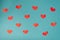 Valentine`s day background, cute hearts flat lay, minimalist banner Wallpaper design. Red paper cut hearts on blue background