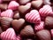 Valentine's Day background with heart shaped chocolate candies.