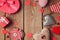 Valentine\'s day background with heart shapes on wooden table. View from top