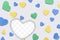 Valentine`s Day background. Isolated multi-colored hearts with transparent heart frame on white background