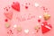 Valentine& x27;s day background with many hearts over wooden pink background.