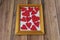 Valentine`s day background. Photo frame, gift, heart and red satin ribbon on a wooden background. Valentine`s Day, Mother`s Day