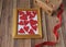 Valentine`s day background. Photo frame, gift, heart and red satin ribbon on a wooden background. Valentine`s Day, Mother`s Day