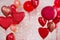 Valentine`s day background - red circle and heart shaped foil balloons