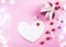 Valentine`s day background. Red gift box, card and candy on pink background. Valentines day concept