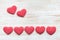 Valentine`s day background with red hearts on wooden planks. Valentine`s Day concept
