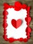 Valentine`s Day background. Red paper hearts are lined with rectangle, on a wooden background with place for text with hearts.