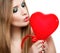 Valentine\'s Day.Beautiful blonde kissing heart