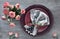 Valentine\'s day, birthday or anniversary table setup, top view on greybackground