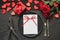 Valentine`s day or birthday dinner. Elegance table setting with red rose on black linen tablecloth