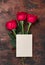 Valentine`s day blank card with red rose flowers on vintage wooden background. Valentines day mockup